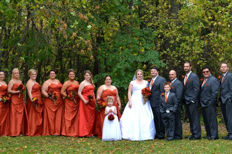 The couple with the bridesmaids and groomsmen