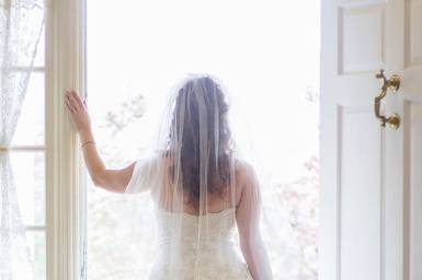 Bride looking out the balcony