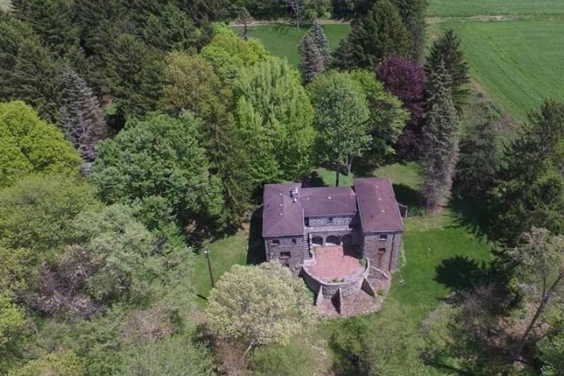 Overhead photo showing the rear of the castle with outdoor balcony overlooking the terrace.