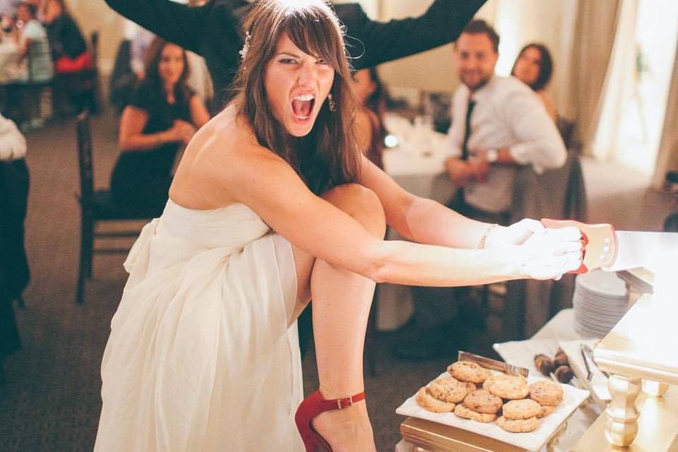 Fun bride cutting cake