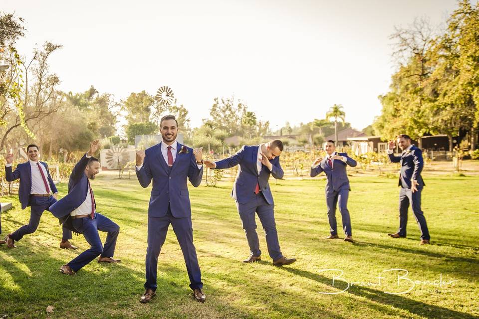 Wedding party strike fun poses outside