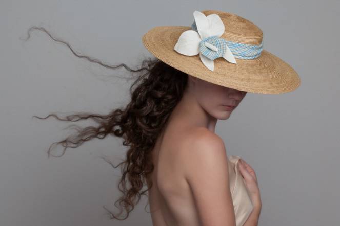 Feminine straw hat adds a romantic touch to your ensemble.