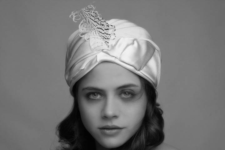 Draped silk crepe turban with pheasant trim