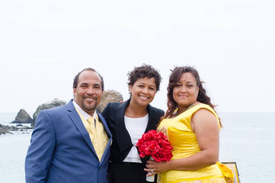 Newlywed couple and the officiant