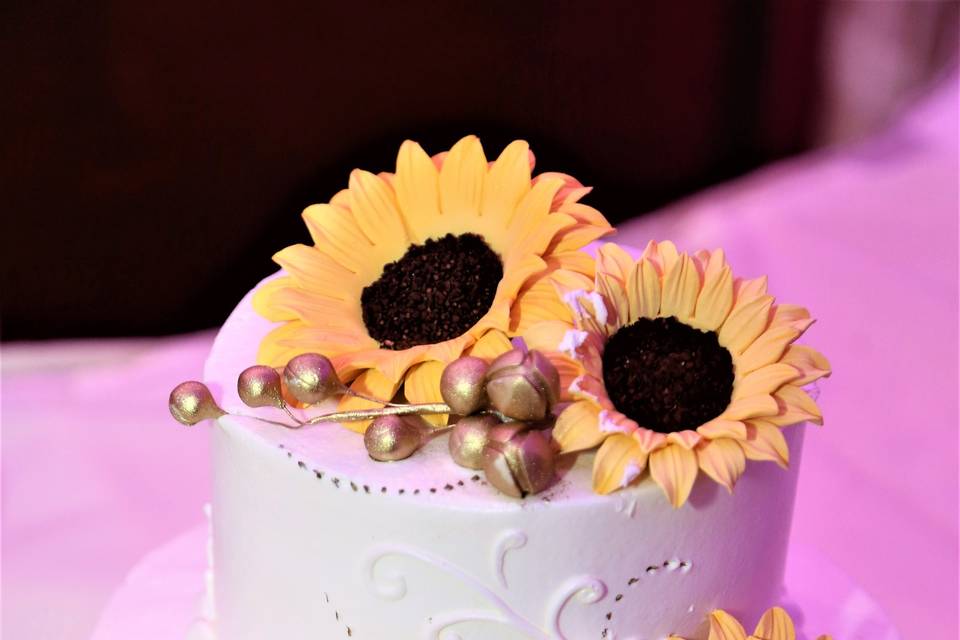 Simple wedding cake with sunflowers