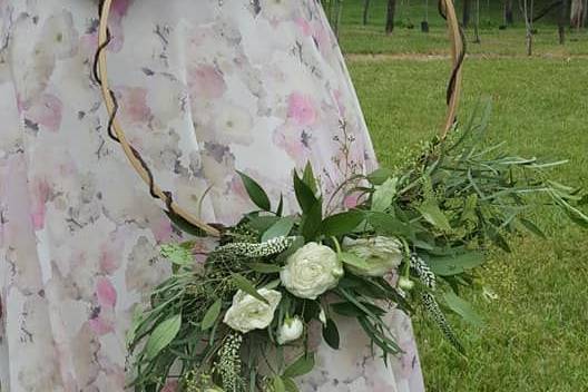 Hoop bouquet with white ranunculus, seeded eucalyptus, feather eucalyptus and white veronica