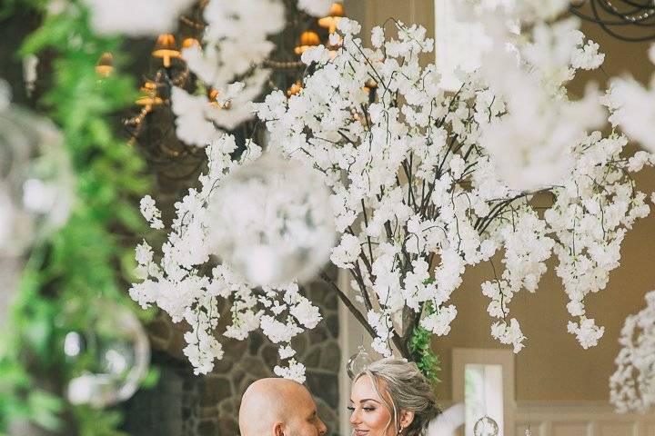 Seated by floral decor