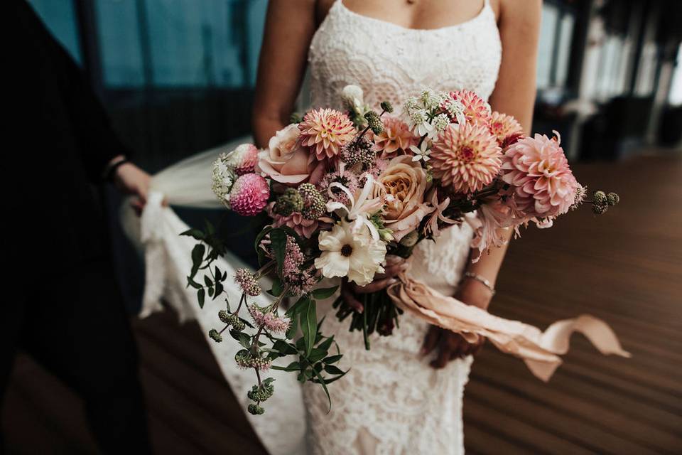 Holding blushing bouquet