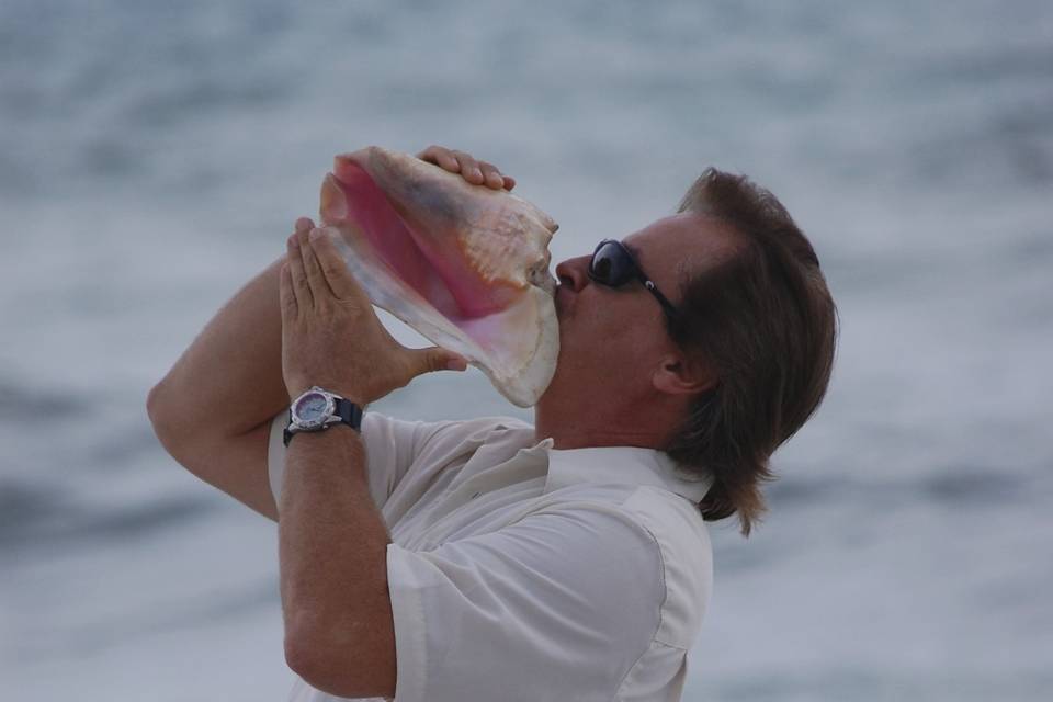Blowing a conch shell
