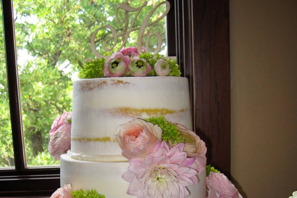 Naked cake with pink flowers