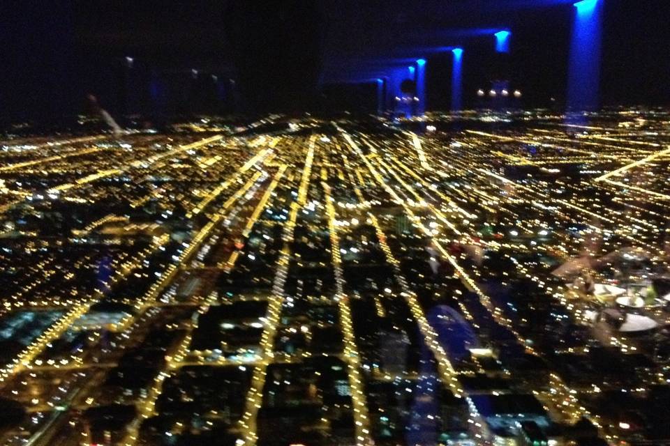 The City of Chicago is awesome and looks even better when up 1454 feet in the SkyDeck in the Willis Tower. This is a view from the dancefloor overlooking the North side of the city!