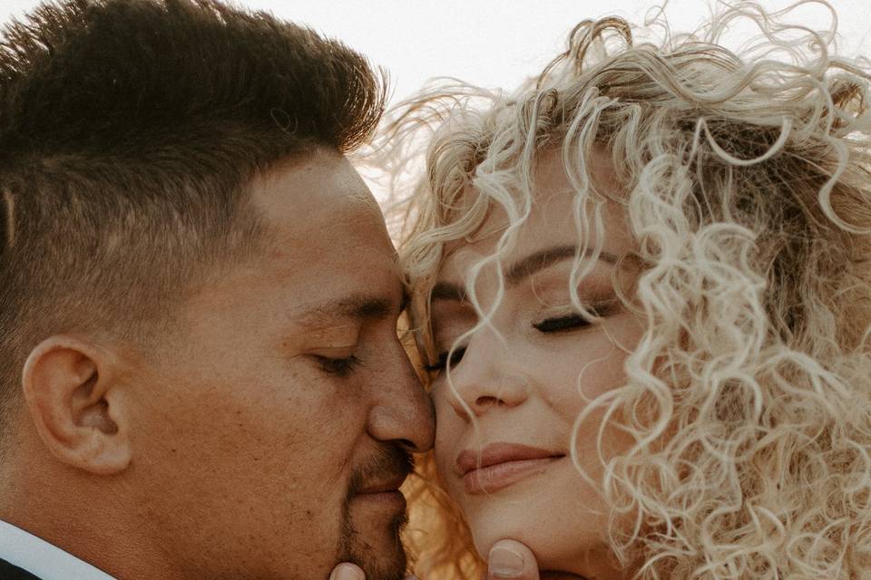 Bride and groom at sand dunes