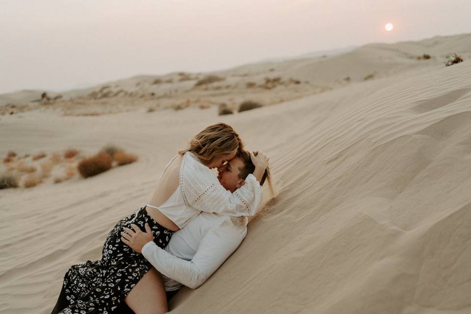 Couple playing in sand