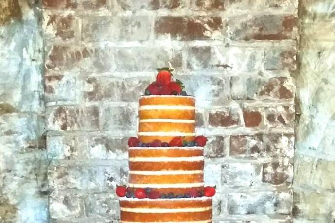 Naked Cake garnished with fresh berries. Contains 134 servings.