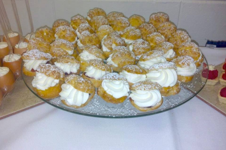 Assortment Profiteroles (aka Cream Puffs) for buffet style dessert table.