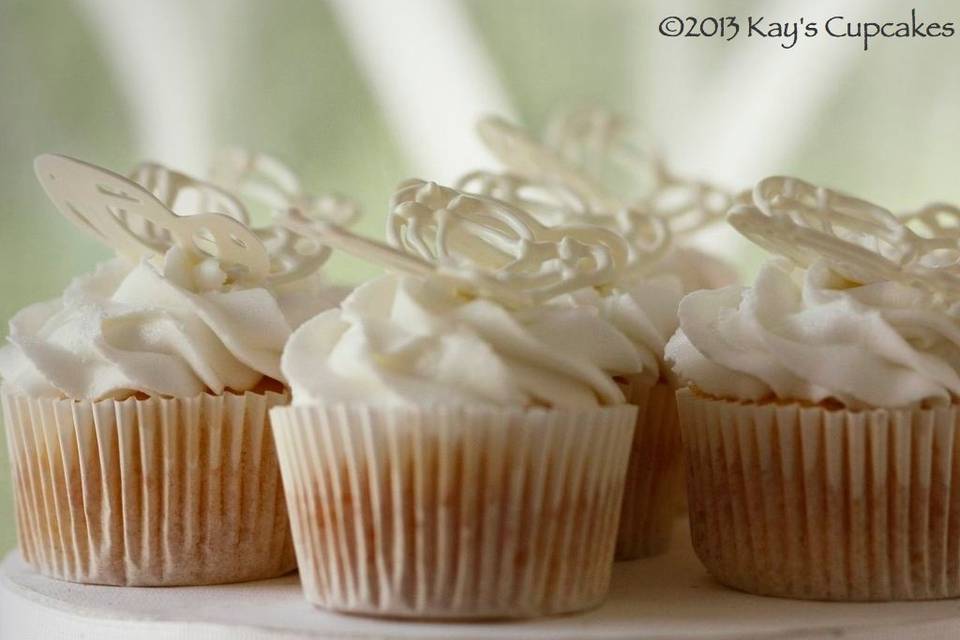 Almond cupcakes with white buttercream and white chocolate butterflies