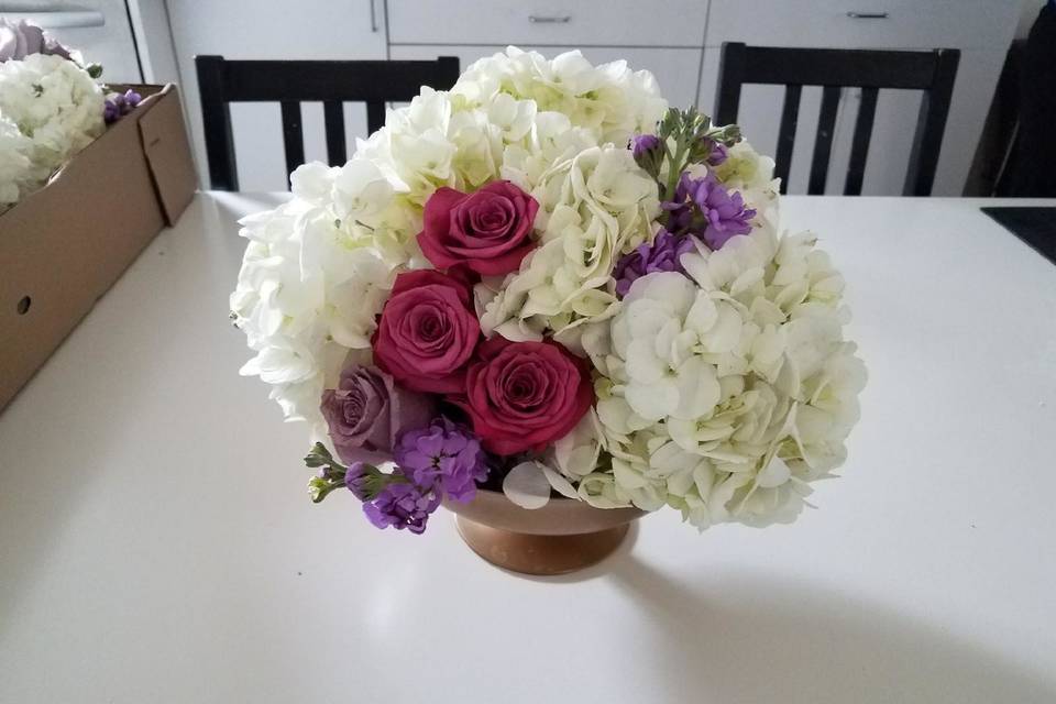White, pink, and purple floral arrangement