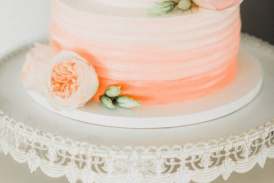 White to peach ombre wedding cake