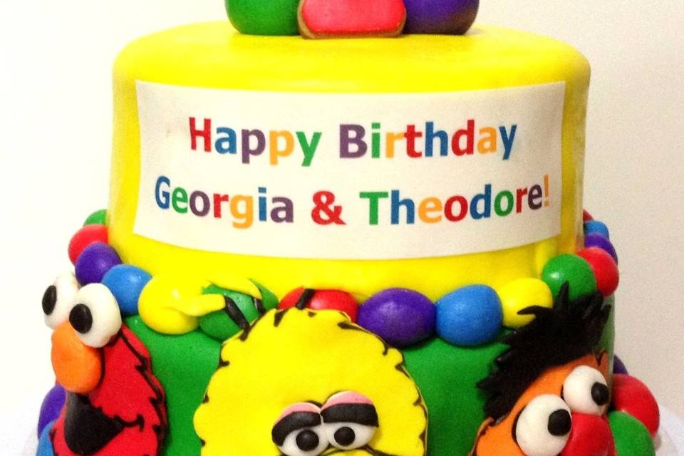 A Sesame St. birthday cake for a pair of lucky twins!  Elmo and Big Bird remain favorites through the years!