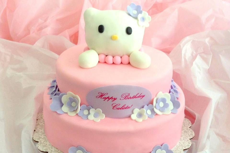 Hello Kitty Cake! Vanilla cake, french vanilla buttercream, our house-made marshmallow fondant, AND A RICE CRISPY HELLO KITTY TOPPER! What more could you possibly want in life?!