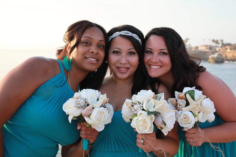 Custom silk flower and  seashell bouquets for the Bride and her beautiful Bridesmaids!