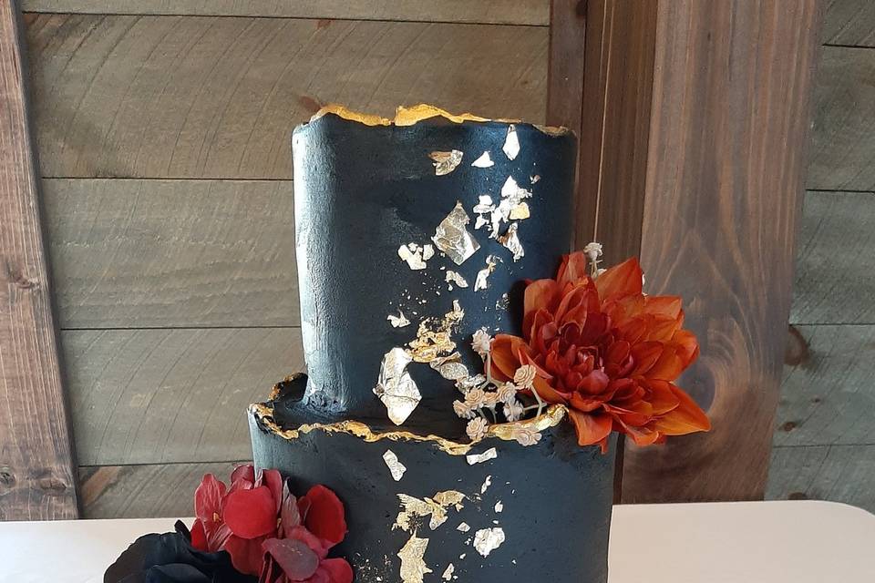 Black wedding cake with gold