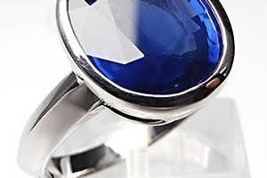 This magnificent bezel set natural blue sapphire engagement ring is crafted of solid 18k white gold and is perfect for the bride to be that wants color.