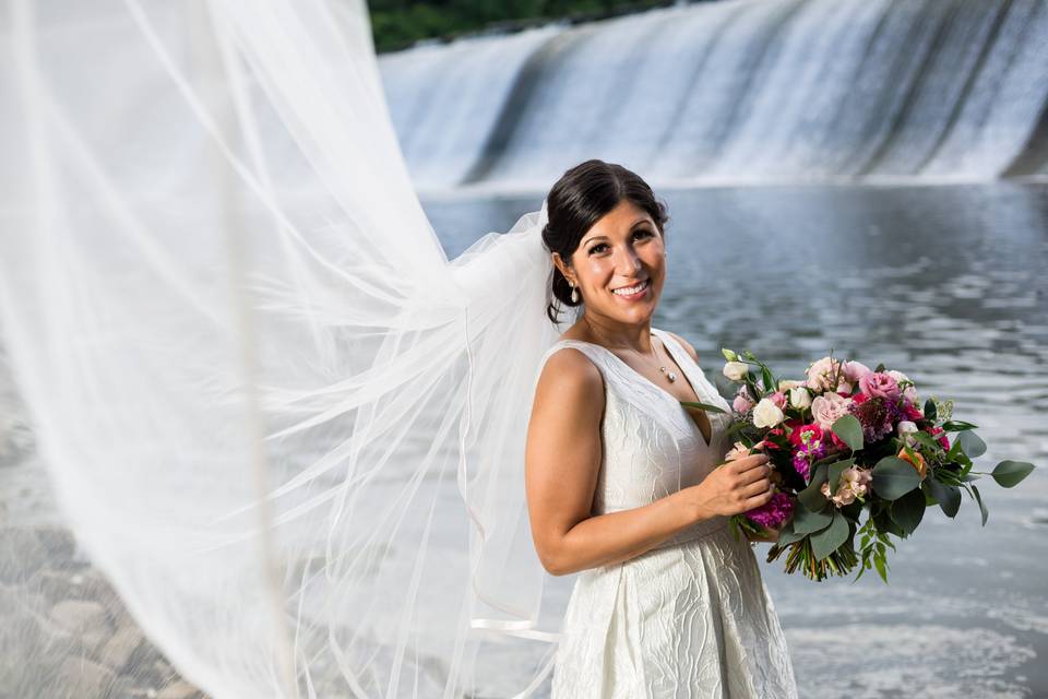 Bride by a waterfall