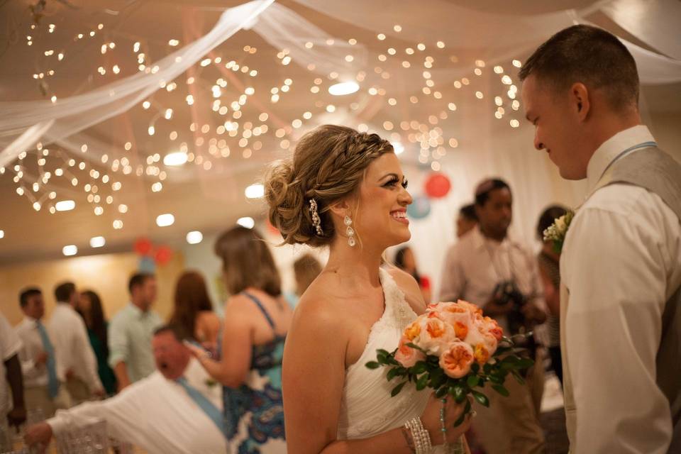 Newlyweds walking on the beach