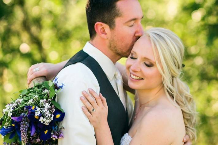 Groom kissing his bride