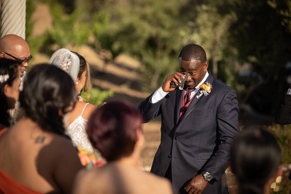 Groom crying at at vows