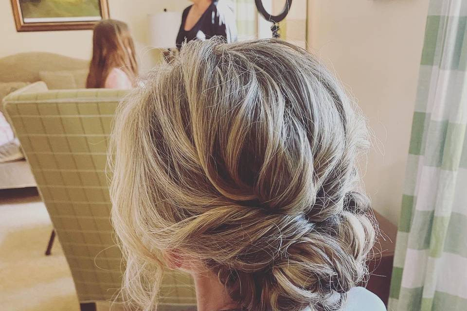 Tousled curled low bun
