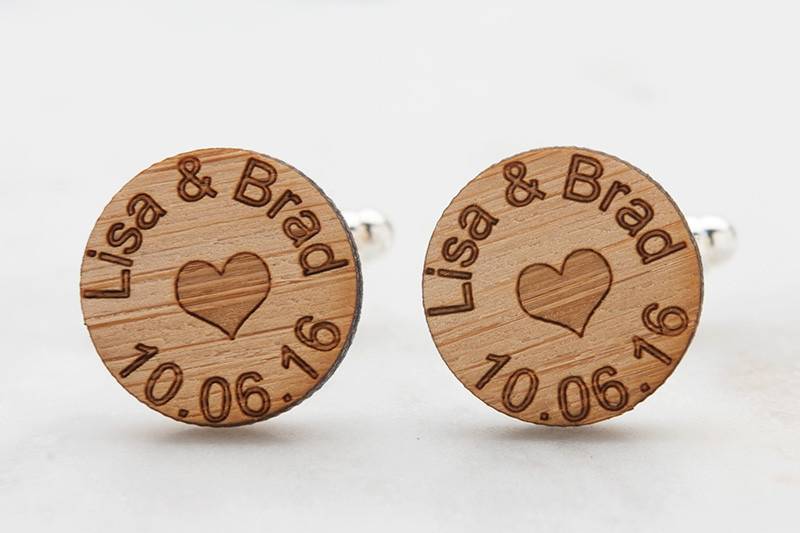 Groom cufflinks laser engraved with names of bride and groom with wedding date.  Tiny heart symbol adds an extra touch of love.