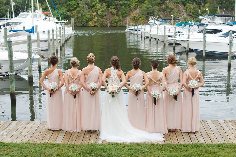 Bride and bridesmaids by the docks