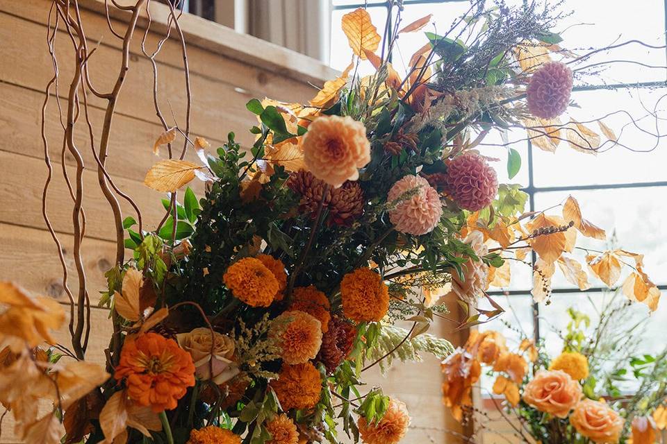 Orange toned ceremony arch