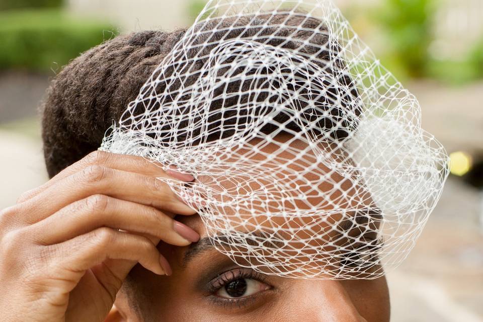 Fixing her veil