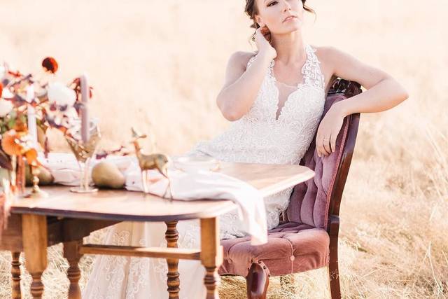 Bride posing in a field | Photo by Tetiana Photography