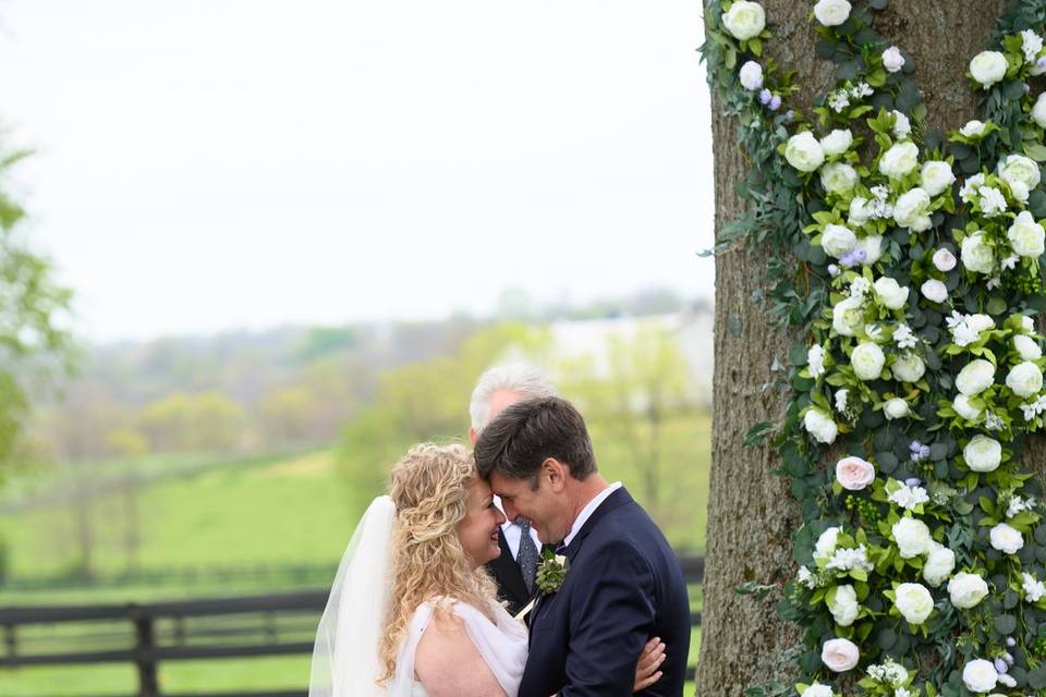 Vows by floral wrapped Oak