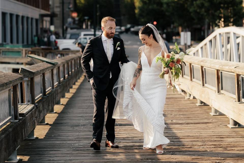 Happy bride and groom on a doc