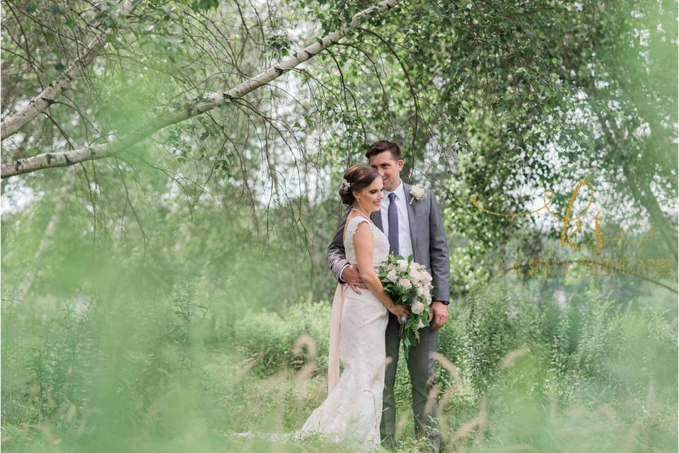 Groom holding his bride