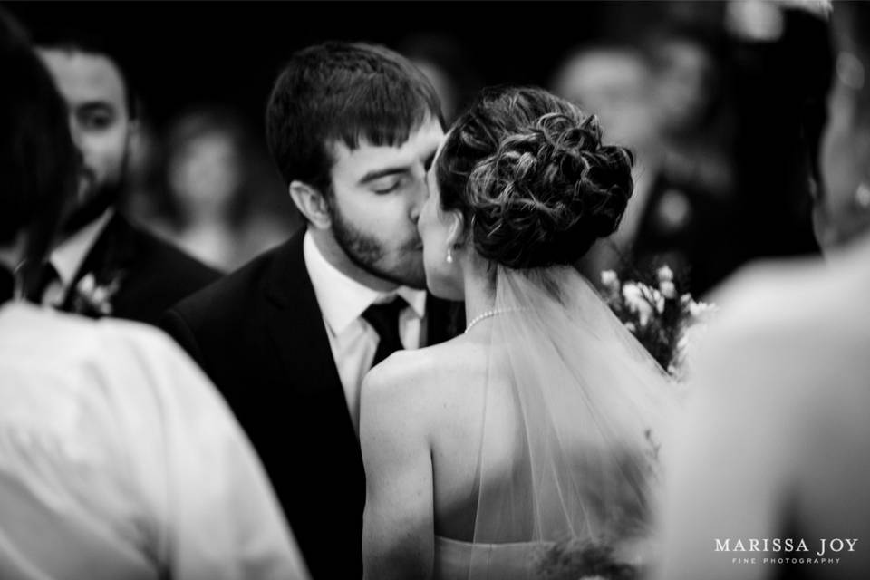 Newlyweds kissing