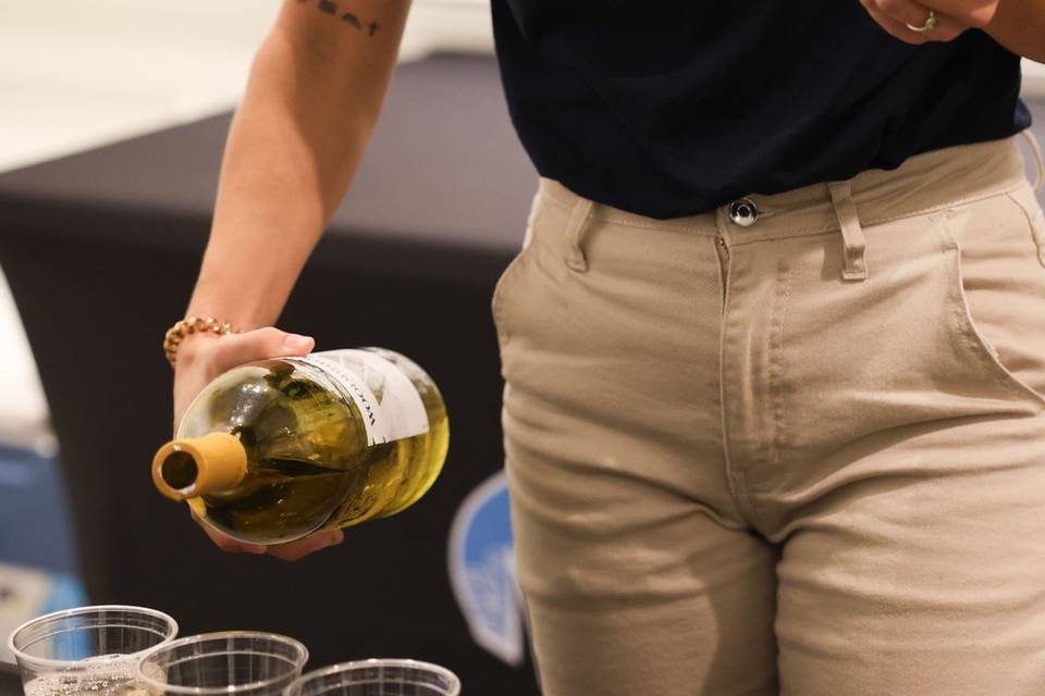 Bri pouring wine