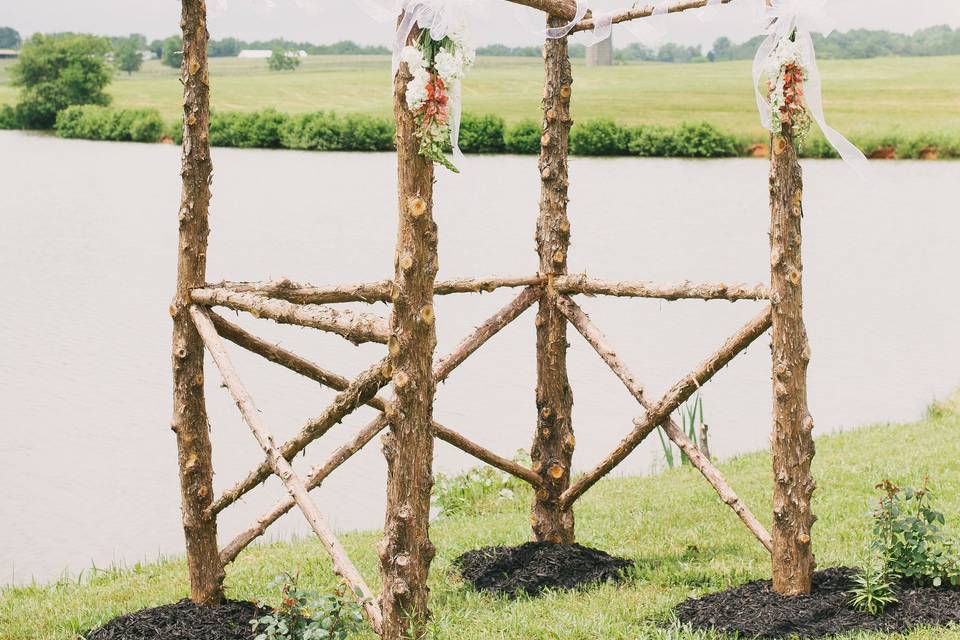 Delicate wedding arch for an elegant outdoor ceremony