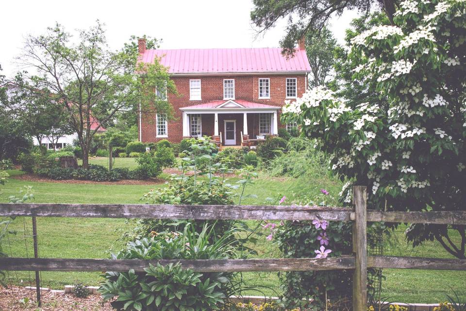 Historic farmhouse hidden among the trees