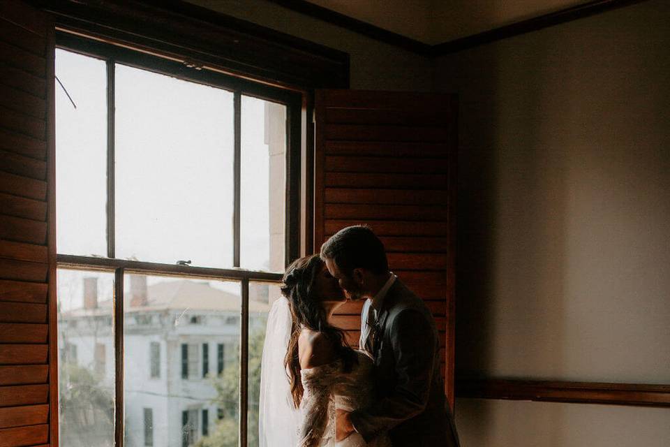 Bride and Groom by window