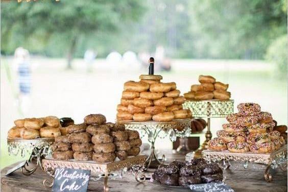 Wooden spools make for the cutest cake table, or in this case, doughnut bar