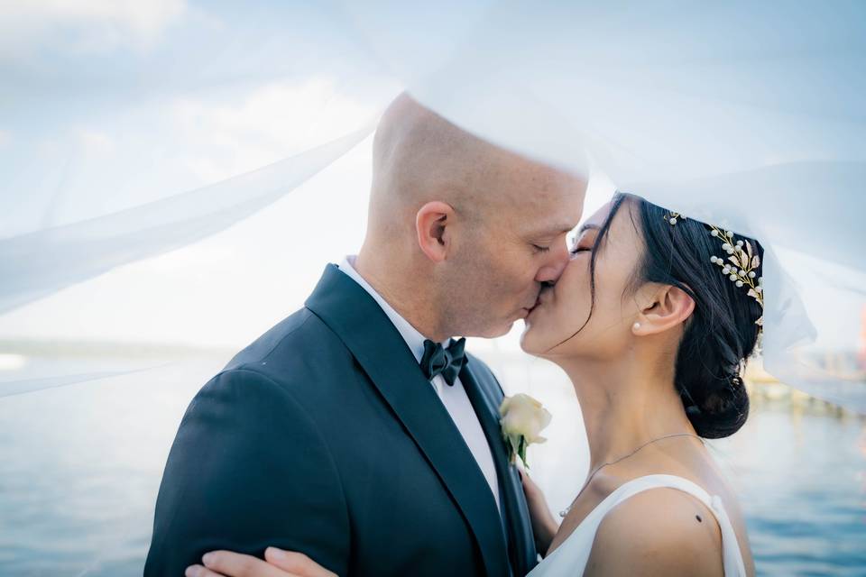 Veil kiss by the waterfront