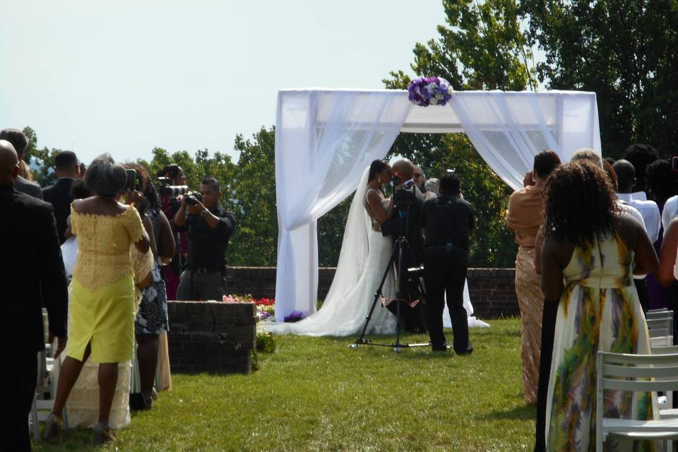 Couple kissing during their ceremony