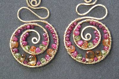 Hammered swirl shapes wrapped with ruby, citrine,
mandarin garnet, peridot, about 2-3/4