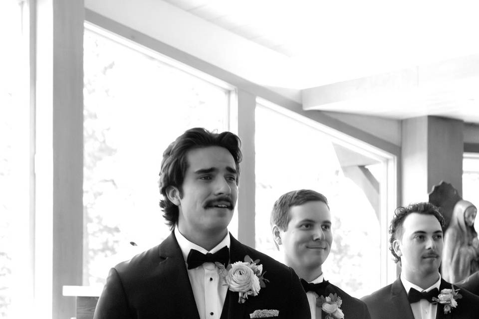Groom tearing up in church